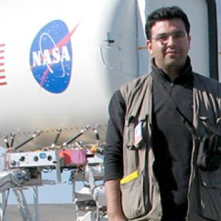Picture of Essam Heggy standing in front of NASA JPL