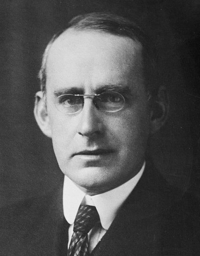 A black and white portrait photograph of Arthur Eddington