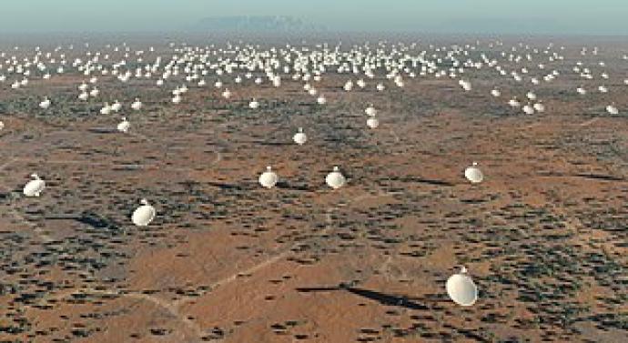 Illustration of a large array of white radio telescope dishes spread across a vast desert landscape, representing the Square Kilometre Array (SKA) project